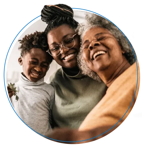 Smiling family shares a hug.