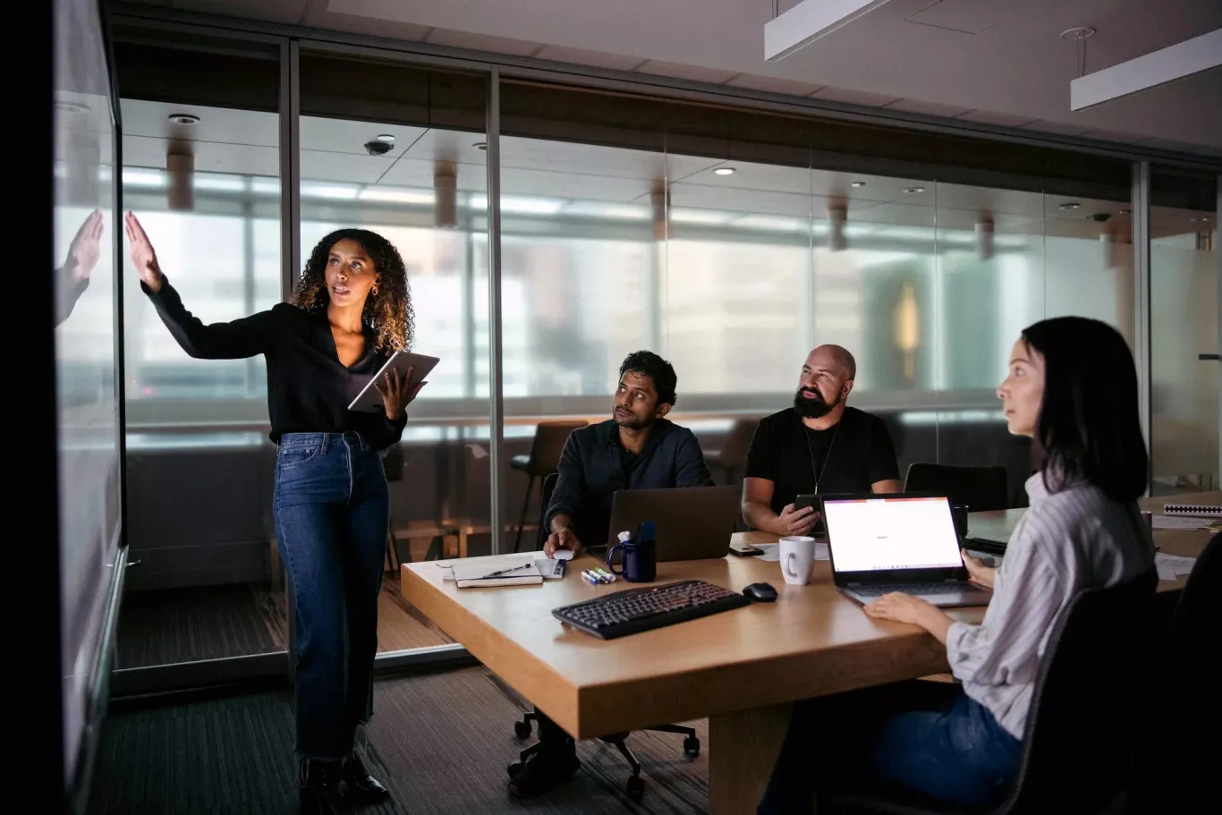 Employee giving a presentation in front of colleagues